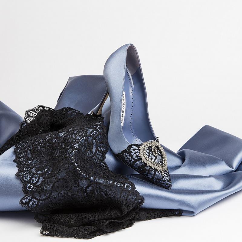 The Summer 2019 Collection. A satin blue pump with heart shaped embellishment. 