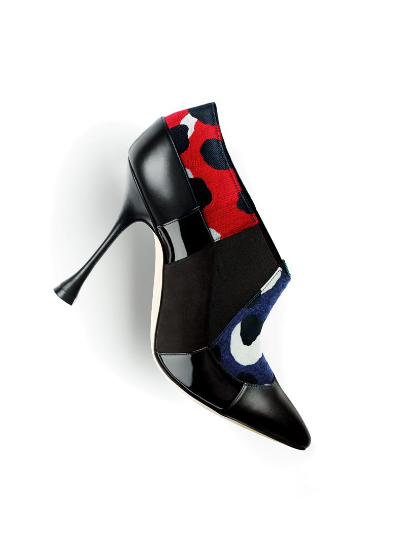 The Autumn 2019 collection. A black ankle boot with patchwork detail.