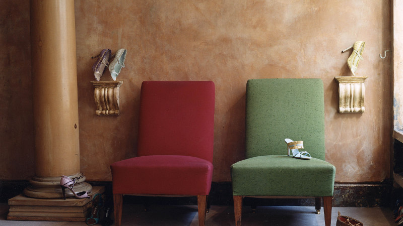 Inside the Old Church Street store. There are two chairs, one red, one green.