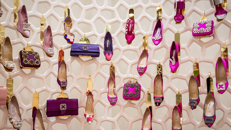 A wall of pink women’s shoes.