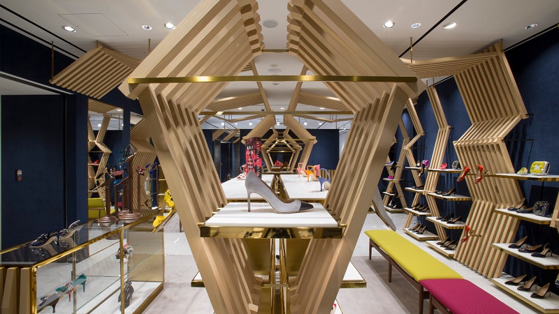 Inside the G6 store. There is an angular wooden structure running down the middle of the store. 