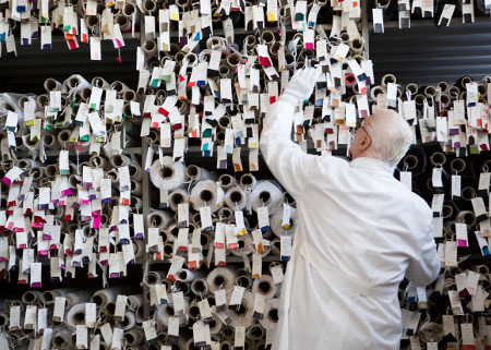 Manolo Blahnik at the factory, looking at fabric samples.