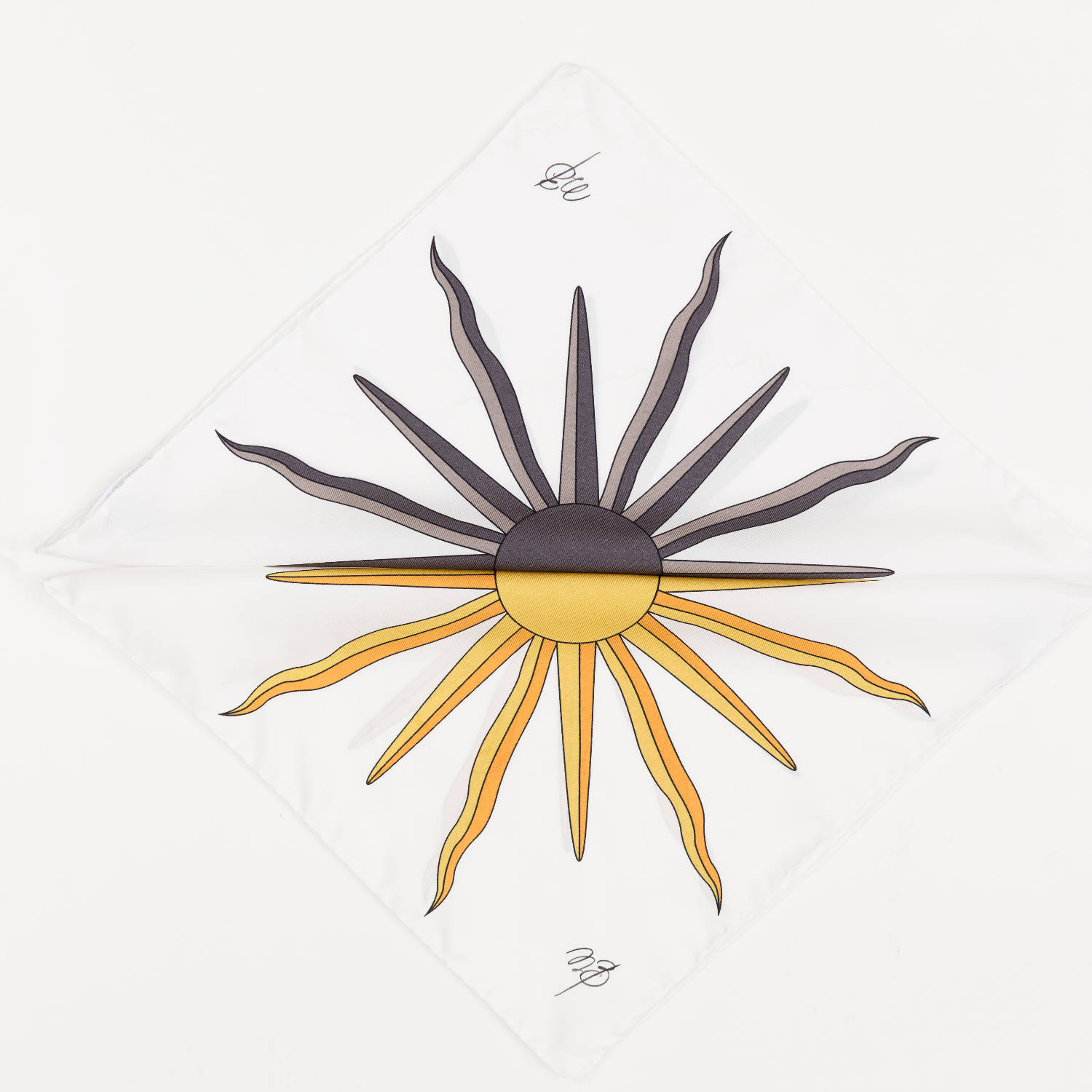 Two pocket squares folded in triangles. There is half a grey sun one and half a yellow sun on the other. Making a full sun.