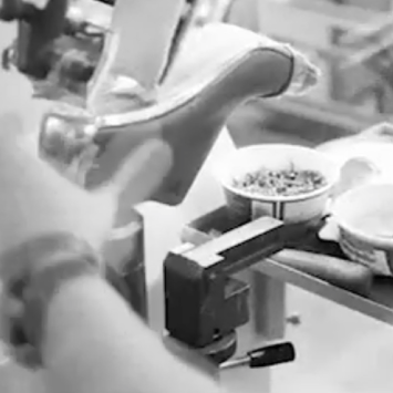 A still from the ‘Manolo at Work’ video. The shoe last is upside down and is being worked on by Manolo.